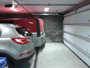 a parking garage with two cars parked in it at Hausamaarbach in Willingen +27 photos