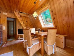 a dining room with a table and chairs in a tiny house at Holiday Home Gräfenroda by Interhome in Dörrberg +20 photos