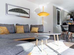 a living room with a couch and a table at Villa Cedelen by Interhome in Plan-de-la-Tour +16 photos