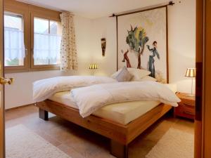En eller flere senge i et værelse på Apartment Laerchehus West by Interhome