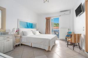 Postel nebo postele na pokoji v ubytování Hotel Lido Thassos