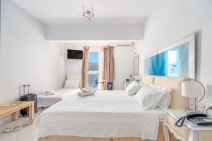 Postel nebo postele na pokoji v ubytování Hotel Lido Thassos