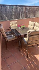 a table and two chairs on a patio at Casa el sabinar in Anchuela del Campo