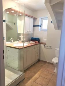a bathroom with a shower and a sink and a toilet at Gîte de la Ferme de la Terve in Bruailles