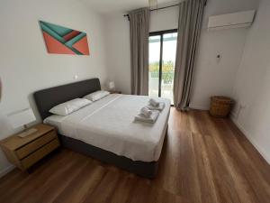 Cama ou camas em um quarto em Julipapas Gardens