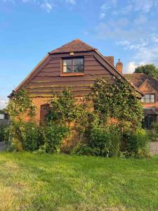 a house with a window on the side of it at Stylish getaway in the heart of the Pewsey Vale in Pewsey