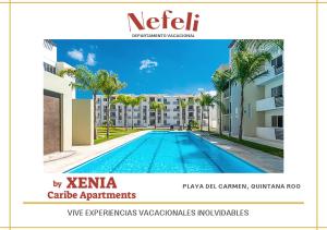 a view of a swimming pool in a building at NEFELI departamento by Xenia Caribe in Playa del Carmen