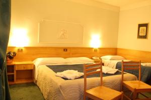 Postel nebo postele na pokoji v ubytování Hotel Villanova