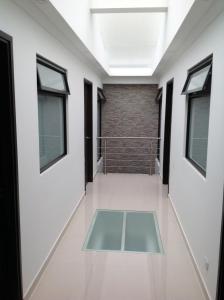 a hallway with windows and a glass floor at Hotel Burana in Bogotá