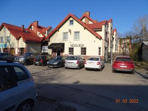 a group of cars parked in front of a building at Noclegi nad Morzem u Kasi in Gdańsk