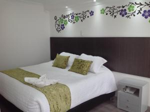 Postel nebo postele na pokoji v ubytování Hotel Burana