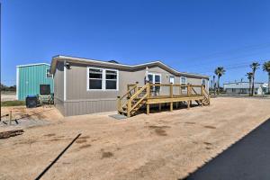 a house with a porch in front of it at Quaint Port OConnor Home Less Than 3 Mi to Beach! in Port O'Connor