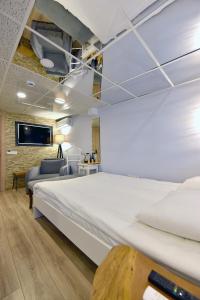 Ένα ή περισσότερα κρεβάτια σε δωμάτιο στο Sunlife Oldcity