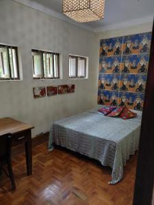 מיטה או מיטות בחדר ב-Charme do Poço