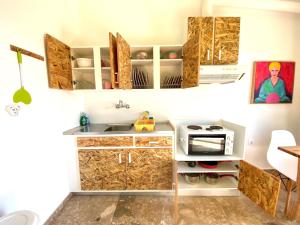 A kitchen or kitchenette at The Beachhouse Apartments