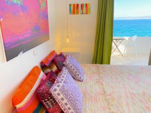 A bed or beds in a room at The Beachhouse Apartments