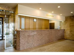 a lobby with a reception desk in a building at Green Hotel Omagari - Vacation STAY 19285v in Daisen