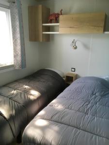 Katil atau katil-katil dalam bilik di Bungalow de 3 chambres avec piscine partagee et jardin amenage a Onzain