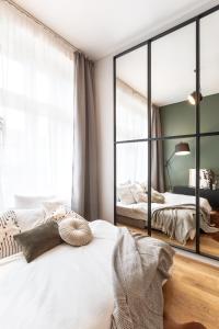 Posteľ alebo postele v izbe v ubytovaní TurnKey I Main Bus Station Apartments