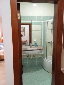 a bathroom with a sink and a shower at Nonna Marija 1 in Rovinj