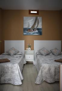 Ένα ή περισσότερα κρεβάτια σε δωμάτιο στο Casa Pano Beach House