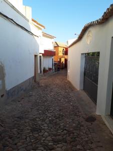 an empty street in a town with buildings at Casa BIBÉ in Silves