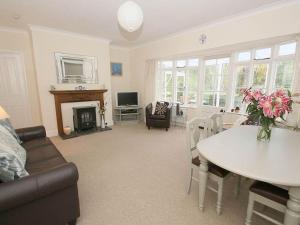 a living room with a table and a dining room at Trelaze in Wadebridge