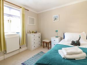 a bedroom with a teddy bear sitting on a bed at Speedwell in Charlestown