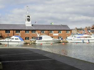 a group of boats are docked in a marina at Rosewaters Cottage in Shrawley