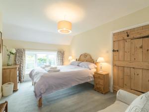 Postel nebo postele na pokoji v ubytování Brian's Cottage