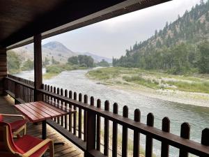 a view of a river from the porch of a house at River's Fork Lodge in Salmon