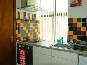a kitchen with a sink and a dishwasher at The Reiver's Retreat in Haltwhistle