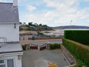 a building with a view of a body of water at Glan Y Don Bach in Abersoch