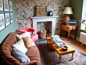 a living room with a couch and a coffee table at Raceside Farm in Silecroft