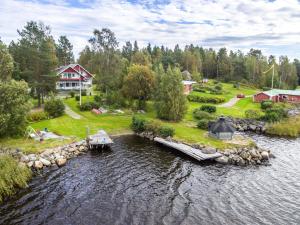 an aerial view of a river with a dock at Beautiful Expansive House with Sea views, large private bedrooms available in shared house in Vaasa