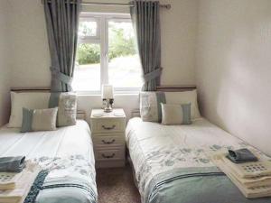 Llit o llits en una habitació de Chaffinch Lodge