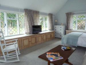 Postel nebo postele na pokoji v ubytování Standard Hill Cottage + 7 fotografií