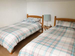 Ένα ή περισσότερα κρεβάτια σε δωμάτιο στο Cottage Fia
