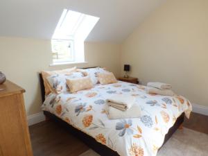 En eller flere senge i et værelse på Lloft Gwair - Hayloft