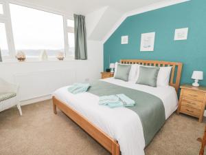 Postel nebo postele na pokoji v ubytování Coastwatch Cottage