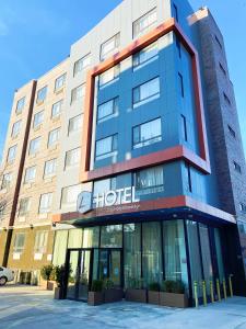 a hotel building with a sign on the front of it at The L Hotel in Brooklyn