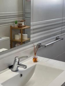 a bathroom with a sink and a mirror at Grupo Morgado - Quinta do Morgado - Morgado House in Tavira
