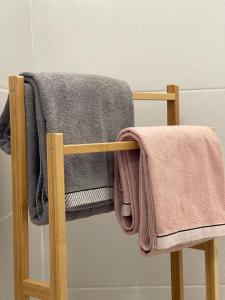 a towel rack with towels on it in a bathroom at Grupo Morgado - Quinta do Morgado - Morgado House in Tavira