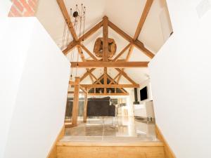 a view of a living room with wooden ceilings at Lower Tundridge Cottage in Suckley