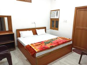Letto o letti in una camera di Natraj Homes