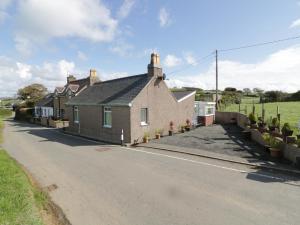 a house on the side of a road at Trigfa Cottage in Abersoch