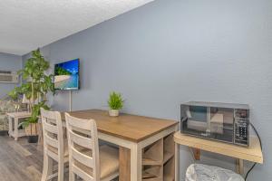 a dining room with a table with a microwave on it at Sea Mist 51408 in Myrtle Beach