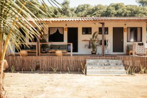 a house with a fence in front of it at Casa Morrillo in Morrillo