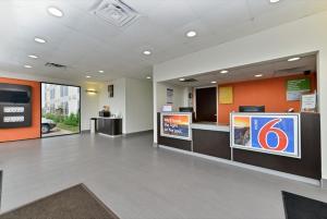 a large lobby with a reception desk in a building at Motel 6-Fort Worth, TX - Downtown East in Fort Worth