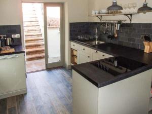 a kitchen with a sink and a counter top at The Stable in Ross on Wye